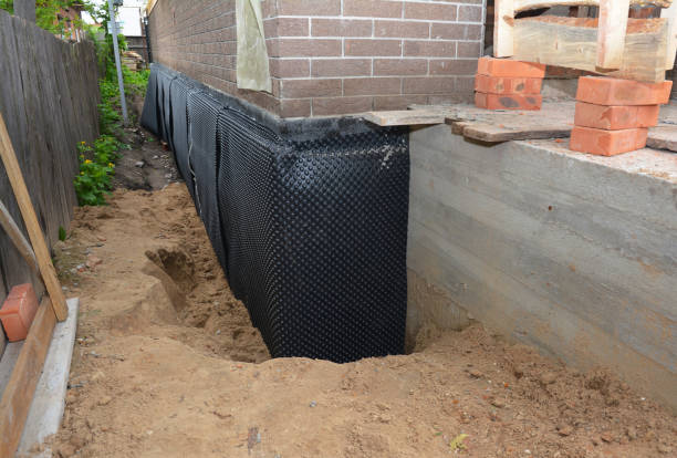 Happy homeowners after waterproofing job in Bainbridge